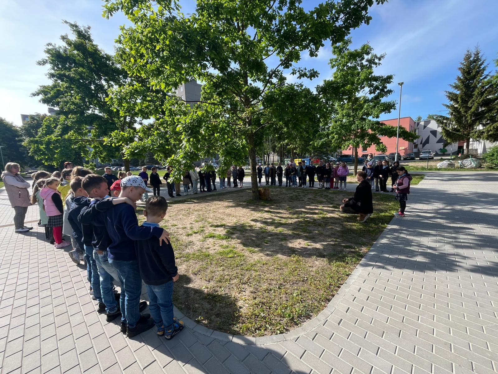 Students lined up outdoors during a project activity